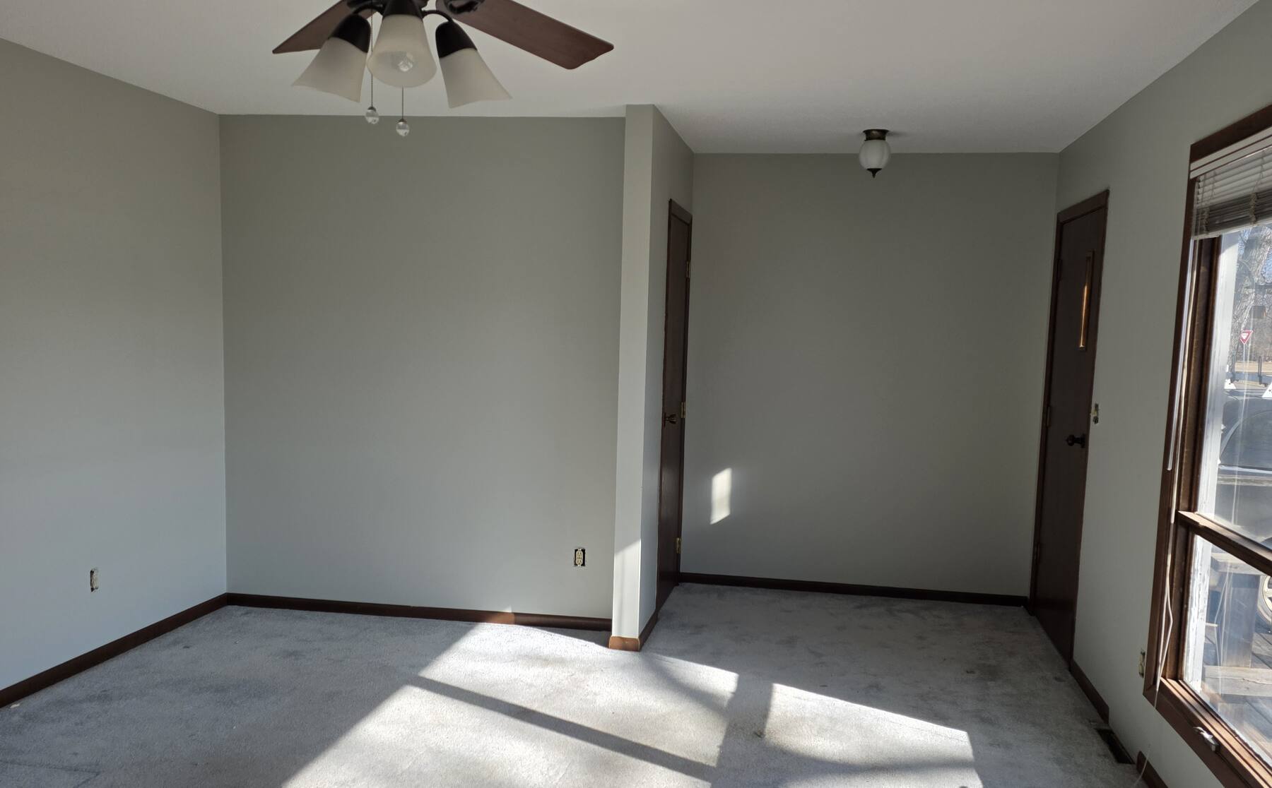 freshly painted bedroom with a ceiling fan