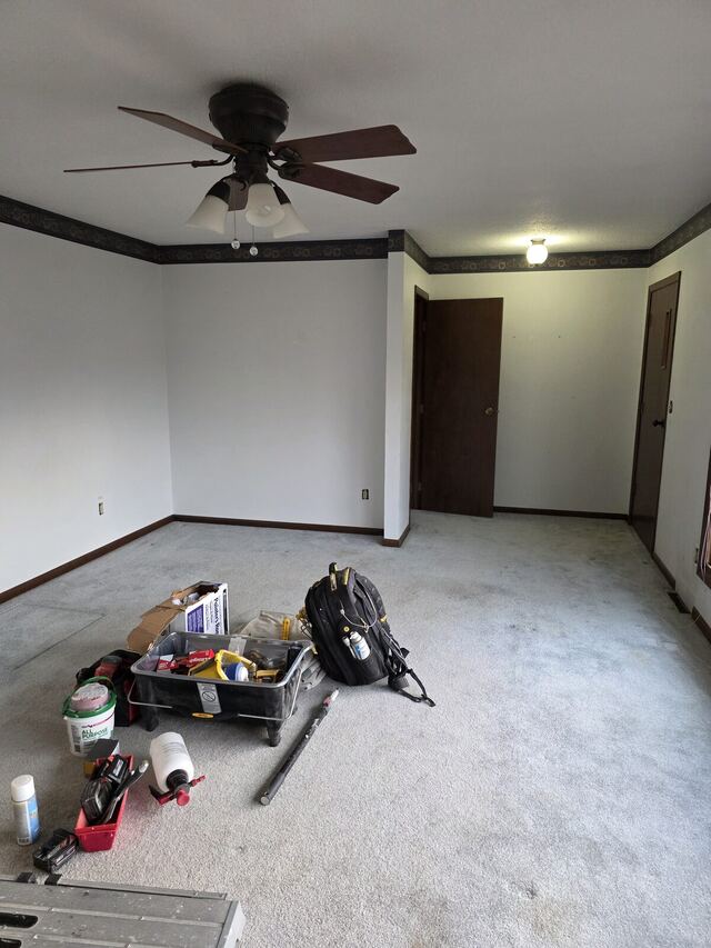 Before: bedroom with a dated wallpaper border removed and the walls repainted a soft gray