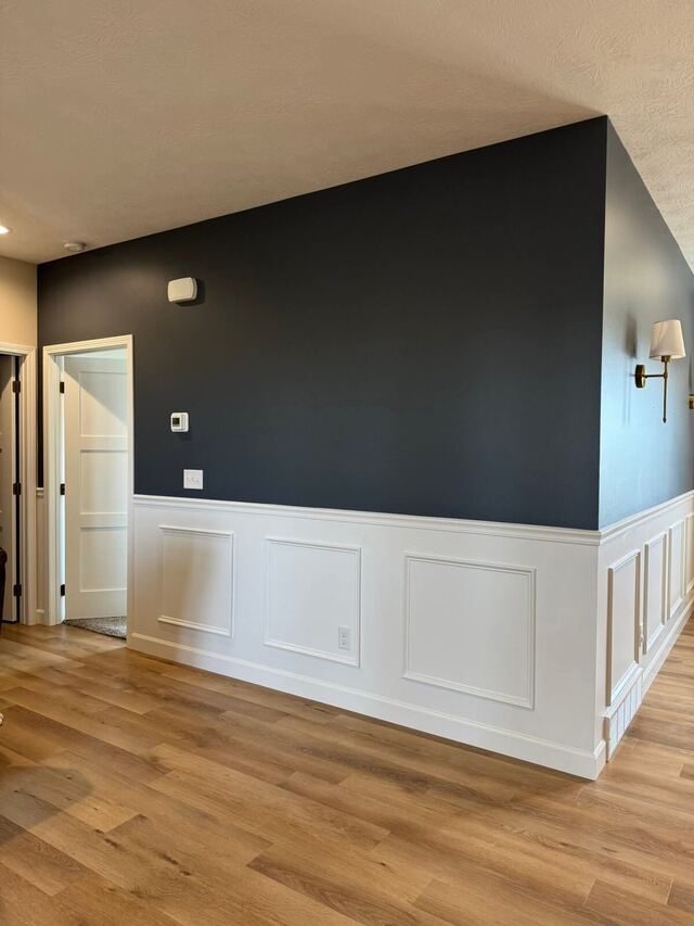 After: hallway wall painted deep navy above white panelled wainscoting